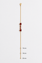 Ophelise solid 10k rose gold bracelet chain with natural red garnet and measurement markers on a white background