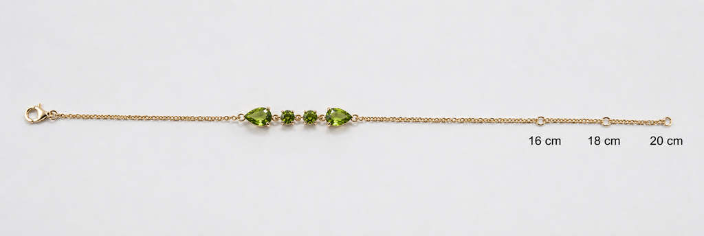 Ophelisse solid 10k yellow gold chain bracelet with two pear-shaped and two round-shaped natural green peridot gemstones with adjustable measurements