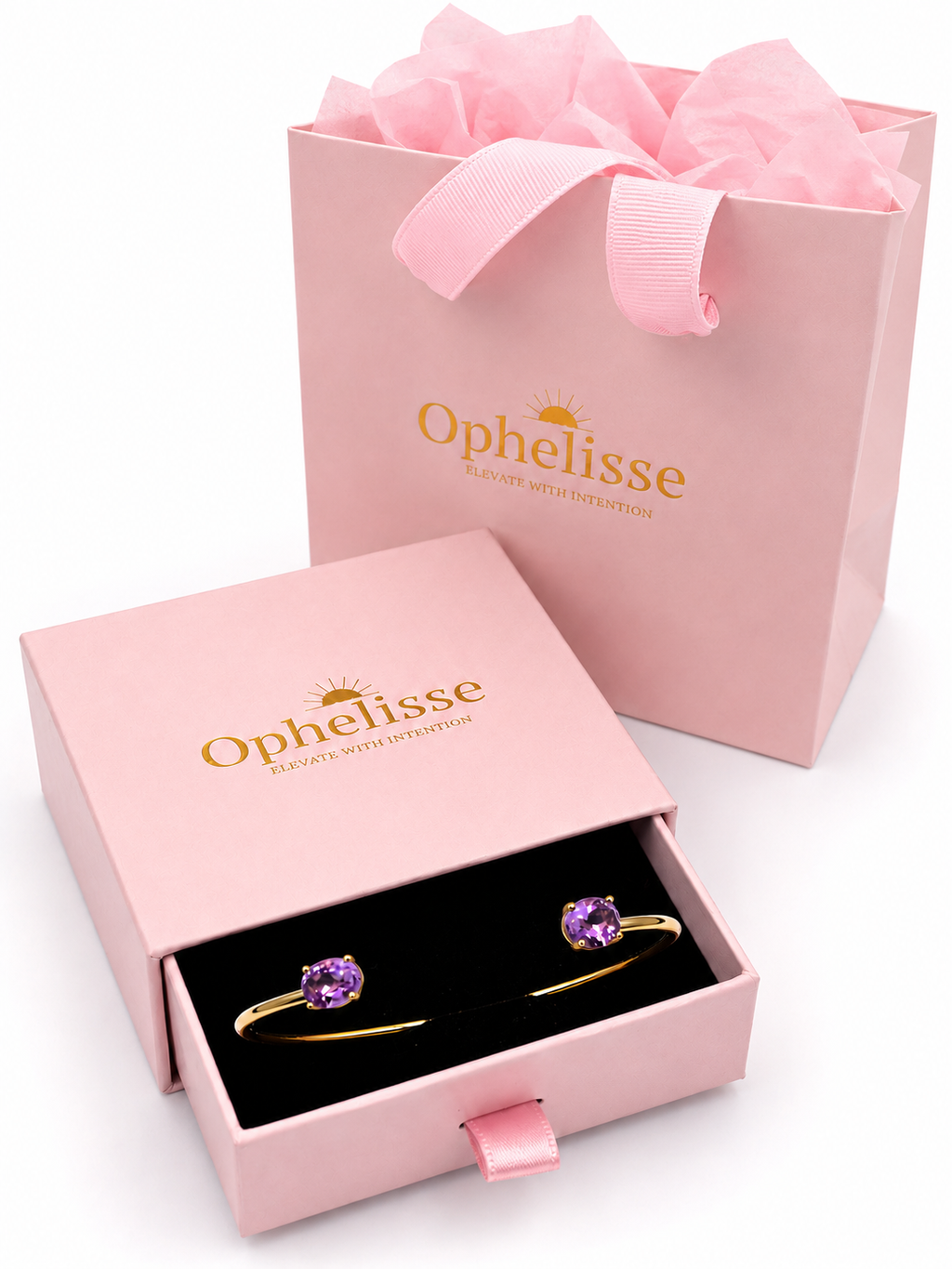 Ophelisse jewelry gift set featuring a solid 10k yellow gold bangle with two natural oval-shaped amethyst purple gemstone, presented in Ophelisse pink box with a pink shopping bag behind it.