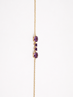 Ophelisse solid 10k yellow gold chain bracelet featuring two oval and two heart natural purple amethyst gemstones, shown closed up and side angle view against white background, horizontal view