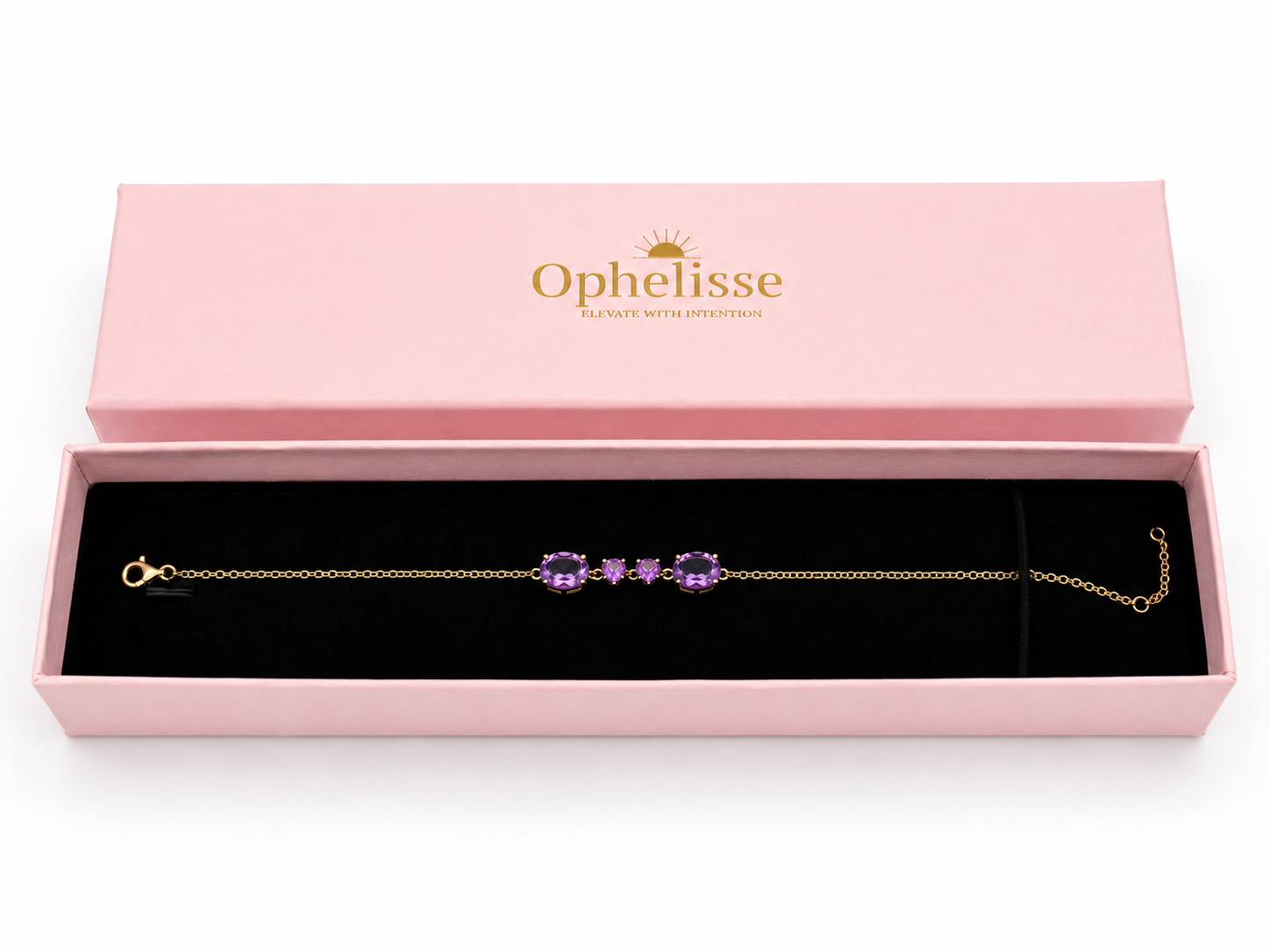 A solid 10k yellow gold chain bracelet with four natural purple amethyst gemstone clusters, presented in an open pink Ophelisse jewelry box with a black velvet interior.