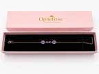 A solid 10k yellow gold chain bracelet with four natural purple amethyst gemstone clusters, presented in an open pink Ophelisse gift box with a black velvet interior.